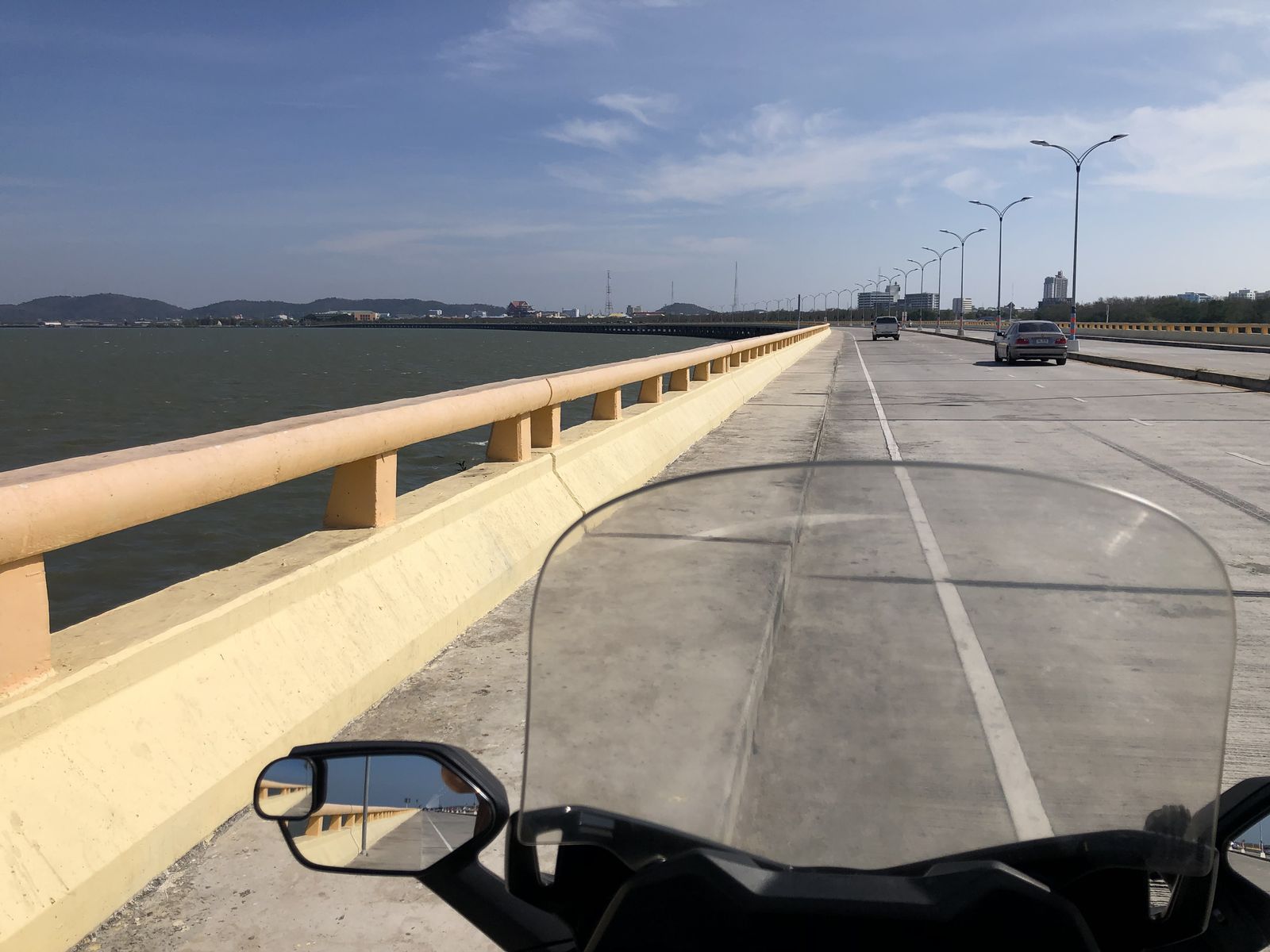 Motorbike view along the Chalomkhawithi Bridge over the sea
